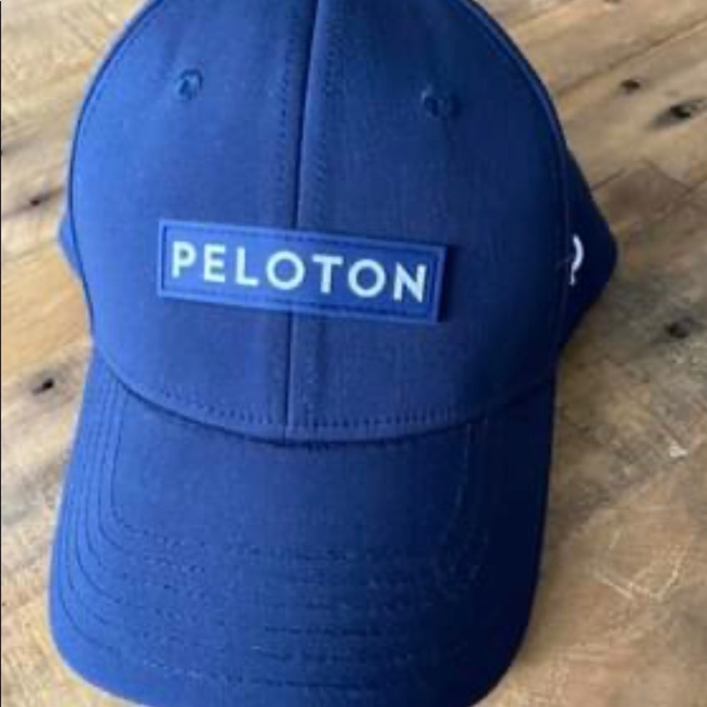 Never worn navy Peloton trucker hat